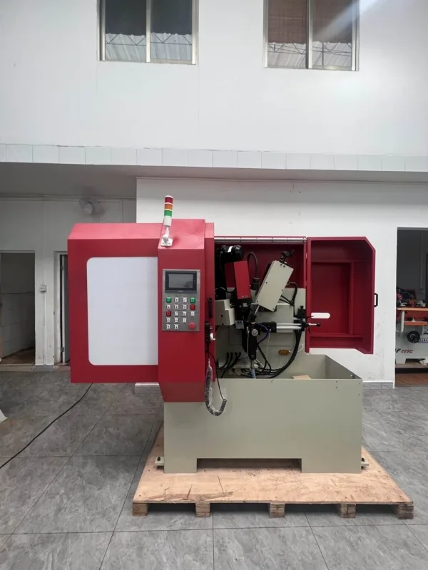 MF158CNC circular saw blade sharpening machine in the workshop, with control panel and grinding area visible